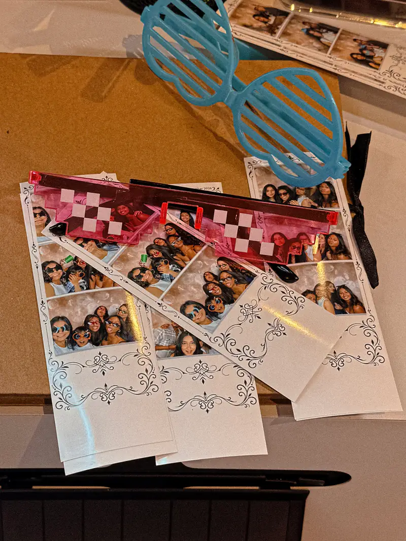Printed photo strips with party glasses on top
